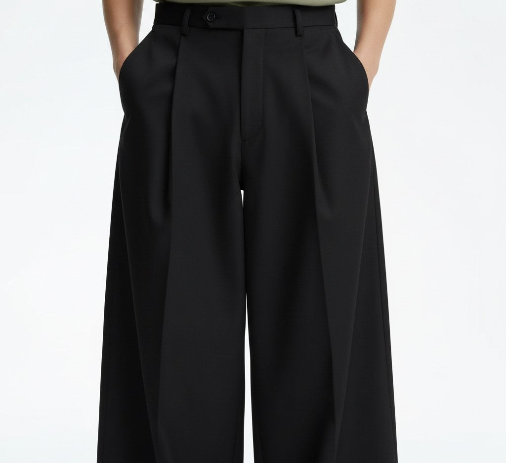 Wide pleated pants on model, close view of the fabric and construction